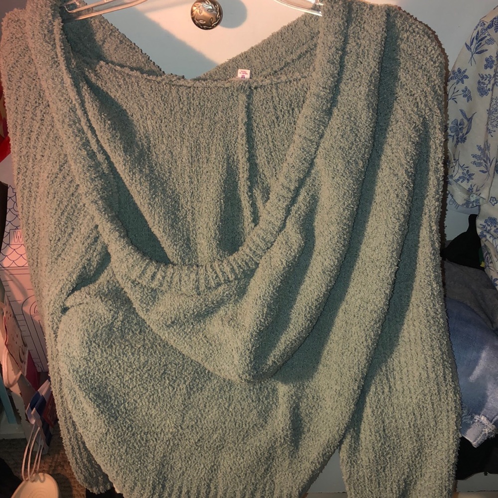 A green fuzzy warm hooded sweater